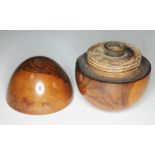 An olive wood souvenir travel ink well of egg shaped form, height 7cm.