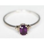 A diamond and amethyst ring, hallmarked 9ct white gold, gross wt. 1.54g, size S.
