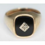 A hallmarked 9ct gold black onyx and diamond signet ring, gross wt. 4.66g, size T.
