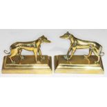 A pair of brass greyhounds on plinths, heights 10cm, length 12cm.
