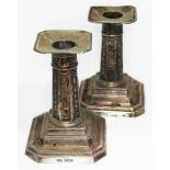A pair of silver candlesticks, James, Dixon & Sons, Sheffield 1919 & 1931, height 10cm.