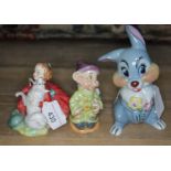 A group of three figures - Royal Doulton Home Again HN 2167, Wade Disney Rabbit, and Beswick