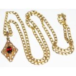 A hallmarked 9ct gold pendant set with an oval cut garnet, length 27mm, on a hallmarked 9ct gold