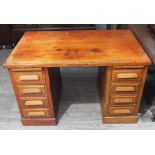 A utilitarian oak pedestal desk.