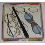 A box of vintage spectacles including tortoise shell lorgnettes.