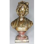 A bronze bust of a lady wearing a bonnet on marble plinth bearing signature J B Greuze, height 17cm.