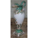 A Copeland ewer decorated with swan handle and spout amongst reeds on four scroll feet in white,