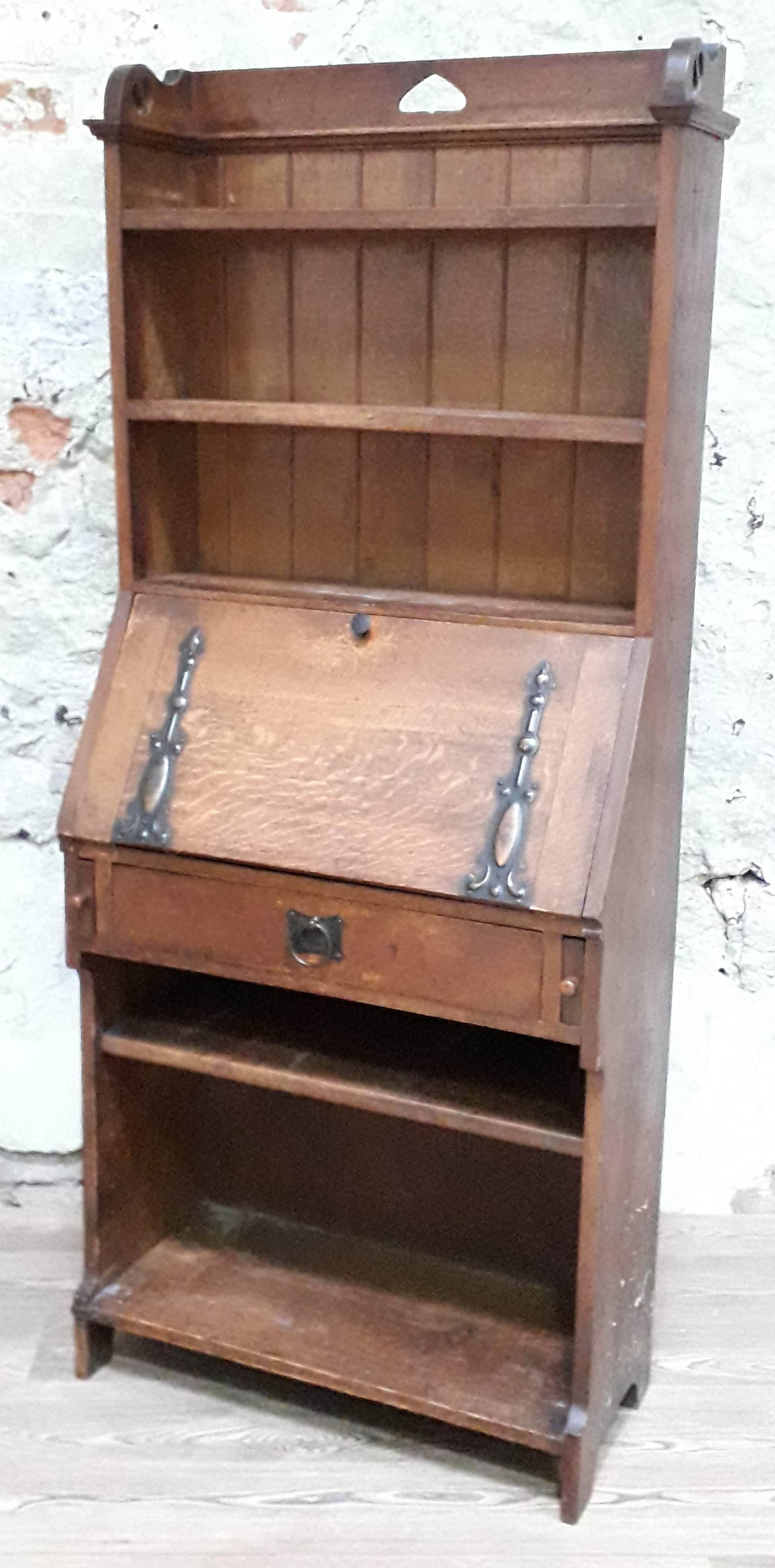 An Arts & Crafts oak bureau bookcase circa 1900 in the manner of Liberty & Co, width 73cm, depth