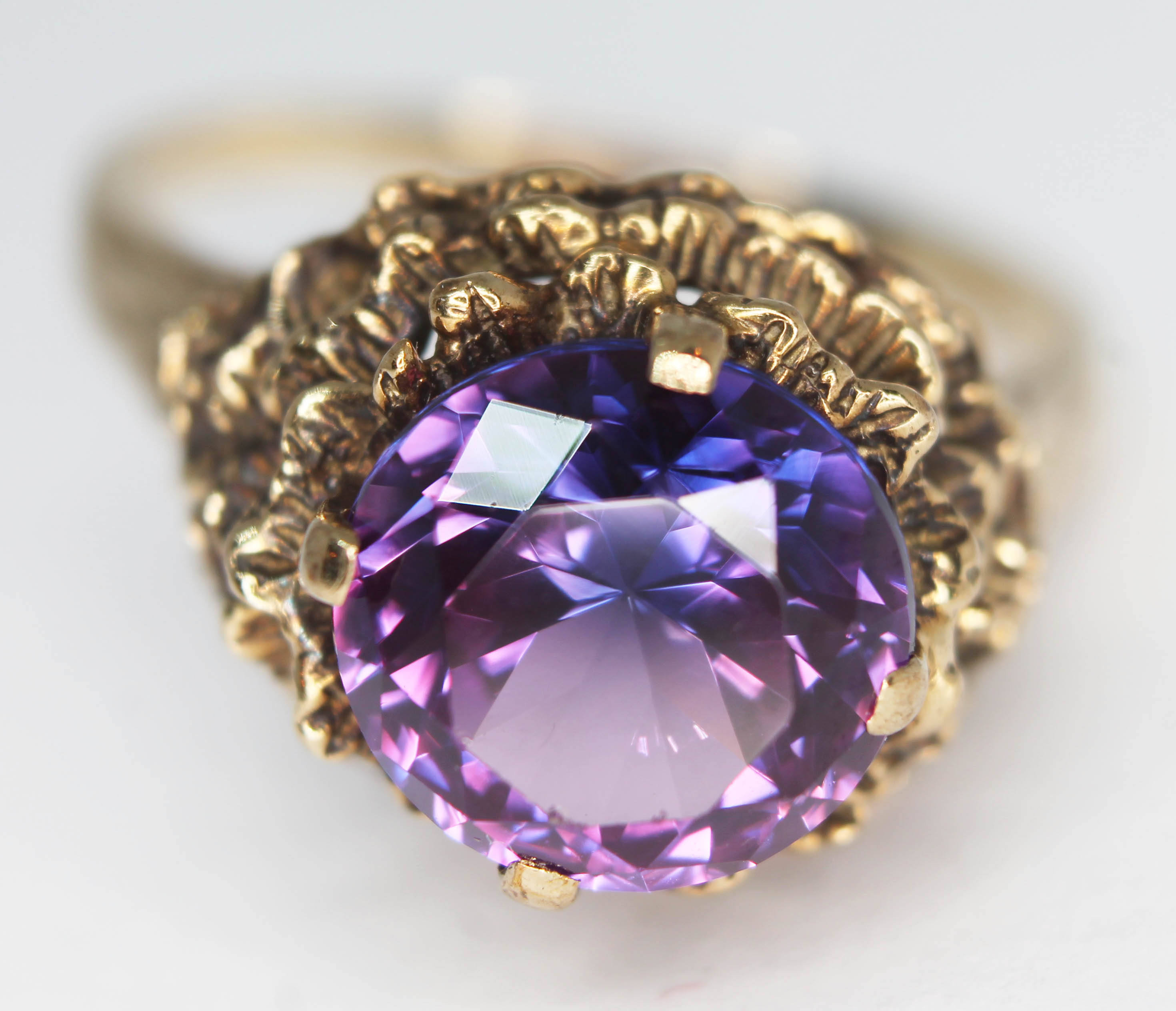 A 9ct gold ring set with a round brilliant cut amethyst, the stone approx. 4.44 carats, band