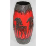 A West German lava pottery vase decorated with stylised horses, height 49cm. Condition - good,