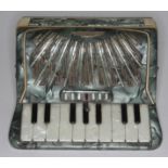 A 1950s novelty fold out musical cigarette box in the form of an accordion.