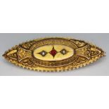 A Victorian hallmarked 9ct gold brooch set with red paste and two split pearls, length 45mm,