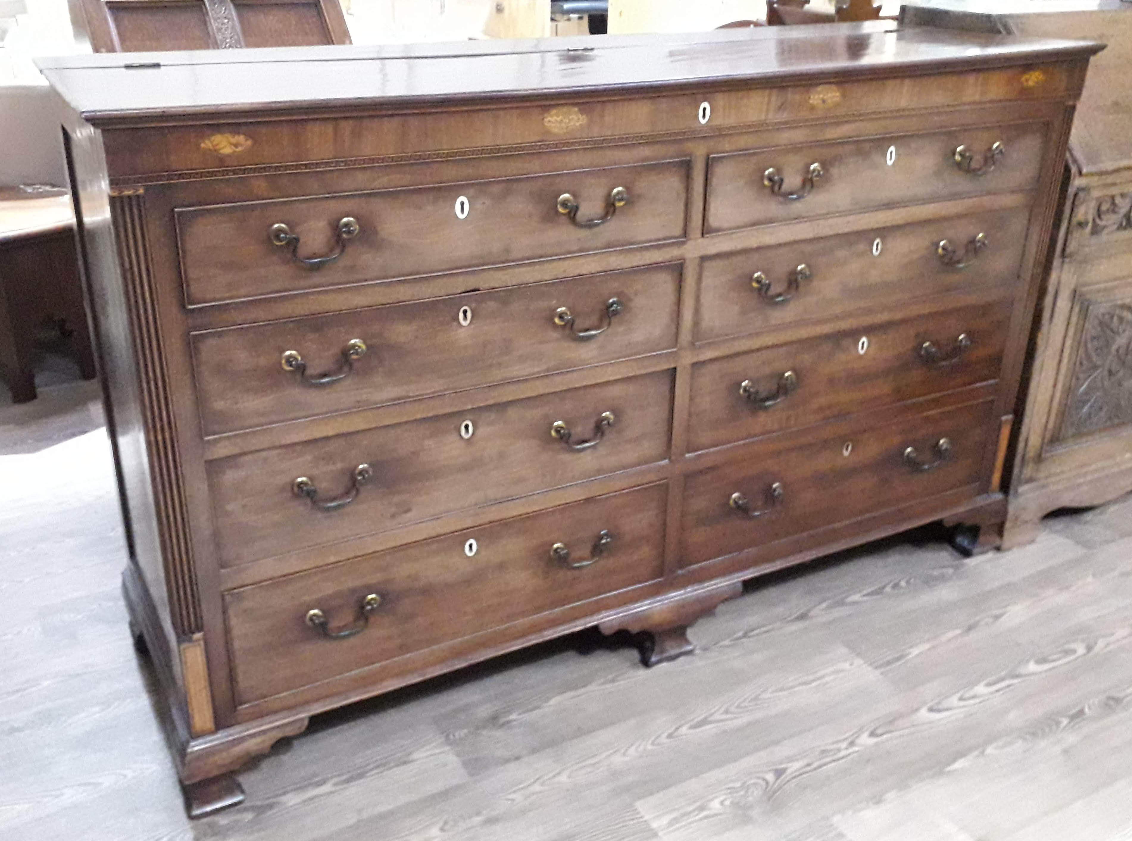 A George III mahogany mule chest, with lift top, acorn and shell inlay, fluted quarter columns,