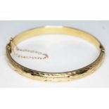 A hallmarked 9ct gold bangle, diam. approx. 58mm, wt. 8.26g.