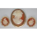 A hallmarked 9ct gold mounted cameo brooch and matched pair of hallmarked 9ct gold mounted clip on