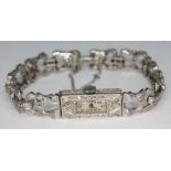 A 1920s Art Deco diamond encrusted platinum cocktail bracelet watch, seventeen jewel movement,