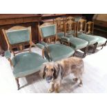 A late Victorian inlaid rosewood salon suite comprising a pair of armchairs, four dining chairs