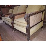 An oak bergere suite with carved goat arms and hoof feet.