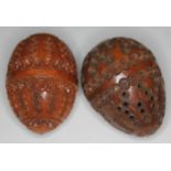 Two small coquilla nuts, heights approx 6cm each.