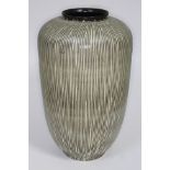A West German pottery vase in striped green and cream, height 50cm.