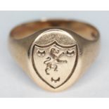 A 9ct gold signet ring with heraldic crest, marked '9ct' with other indistinct marks, possibly