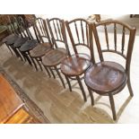A matched set of eight bentwood chairs.