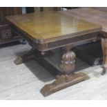 A 1930s oak drawer leaf extending table with bulbous supports, min. length 121cm, depth 90cm &