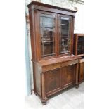 An early Victorian mahogany cabinet bookcase, the top section with cornice, glazed doors and faux