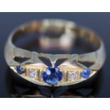 A late Victorian/Edwardian diamond and sapphire ring, marks worn, gross wt. 2.12g, size R.