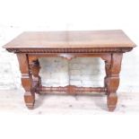 A Victorian oak ecclesiastical console table, carved in an architectural manner with turned H