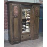 An Arts & Crafts green stained ash bedroom suite circa 1900 by Shapland & Petter, comprising reverse