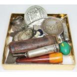 A mixed lot including a pressed amber cheroot holder, a Booth centenary tea caddy, various