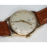 A 1950s hallmarked 9ct gold Tudor Rolex wristwatch with champagne signed dial, Tudor rose emblem,