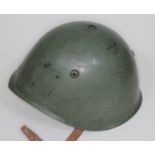 An Italian WWII helmet with leather liner inscribed 'Marzelli 1938'.