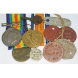 A WWI pair inscribed 2911 A. CPL. W. LEWIS. R. SCOTS. together with various associated tags.