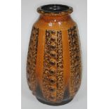 A West German pottery vase in textured brown, height 43cm.
