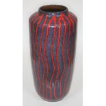 A West German lave vase decorated in red wavy stripes on purple ground, height 43cm.
