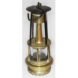 A rare 19th century R. Johnson Clapham & Morris miner's brass safety lamp, height 24cm.