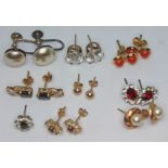 A mixed lot of earrings including to pairs marked '375' and set with various stones gross wt. 1.