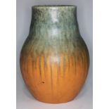 A Ruskin pottery vase with green and orange mottled and crystalline glaze, with impressed mark,