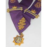 A Royal Antediluvian Order Buffaloes Roll of Honor sash with enamel drop medallion marked 9ct, wt.