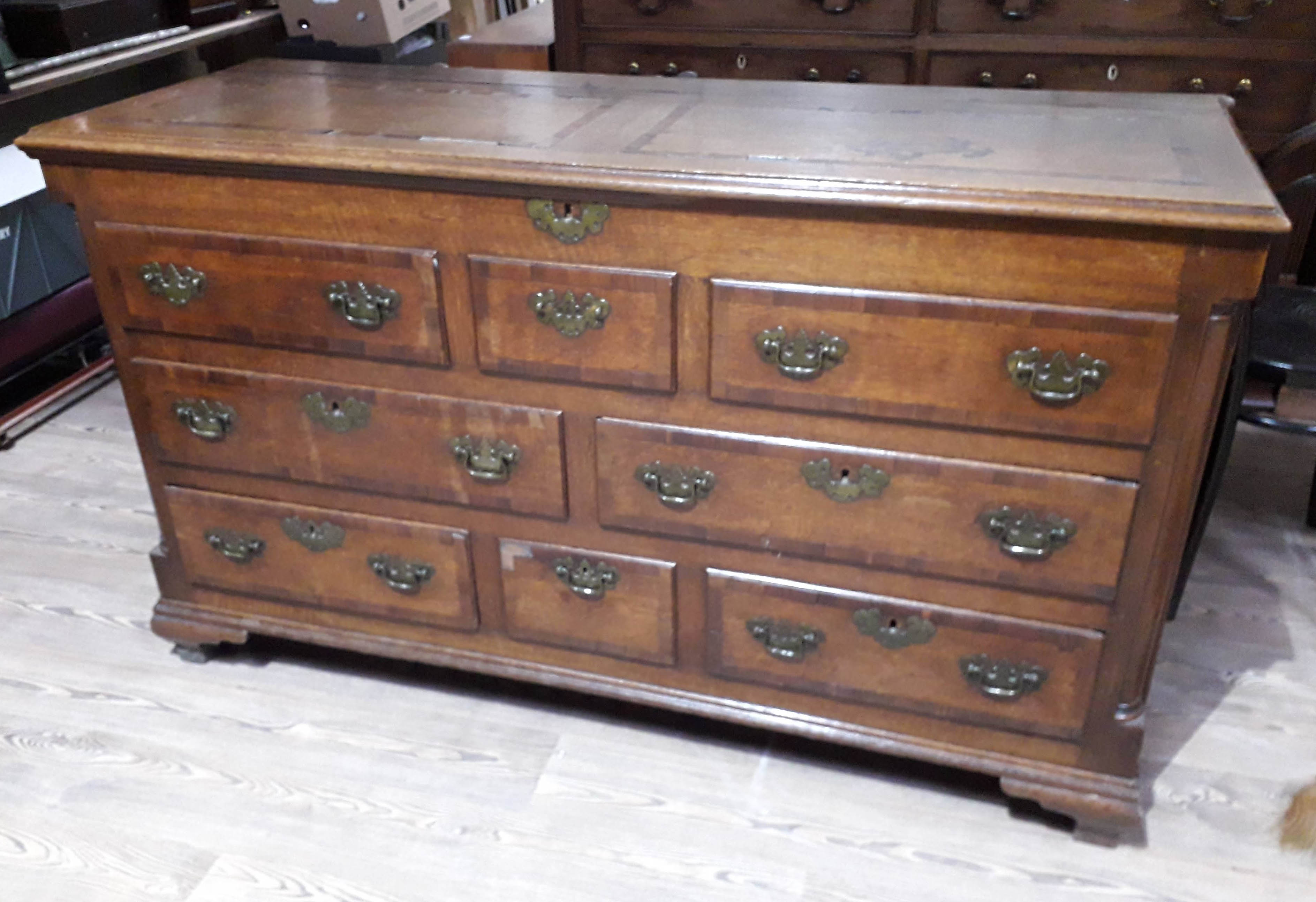 A Georgian oak mule chest, length 152cm, depth 56cm & height 89cm.