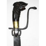 An eastern short sword, single edged curved blade, length 58cm, wrought metal cobra hilt and
