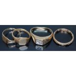 A group of rings comprising one hallmarked 9ct gold and set with diamonds, a hallmarked 9ct gold