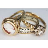 A group of three hallmarked 9ct gold rings, gross wt. 5.51g, size M-O.