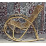A vintage cane rocking chair in the manner of Franco Albini.
