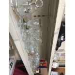 Collection of glassware to include crystal, a quartz clock and a Wade jug.