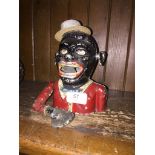 Cast iron jolly man bank with top hat.