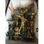 A box of brass candlesticks