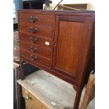 A mahogany music cabinet